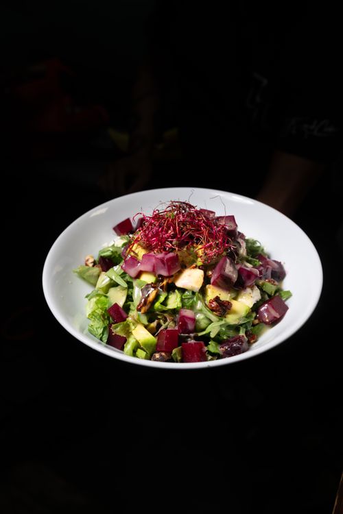 Free Fresh salad with beetroot, avocado, cheese, and greens in a studio setting. Stock Photo