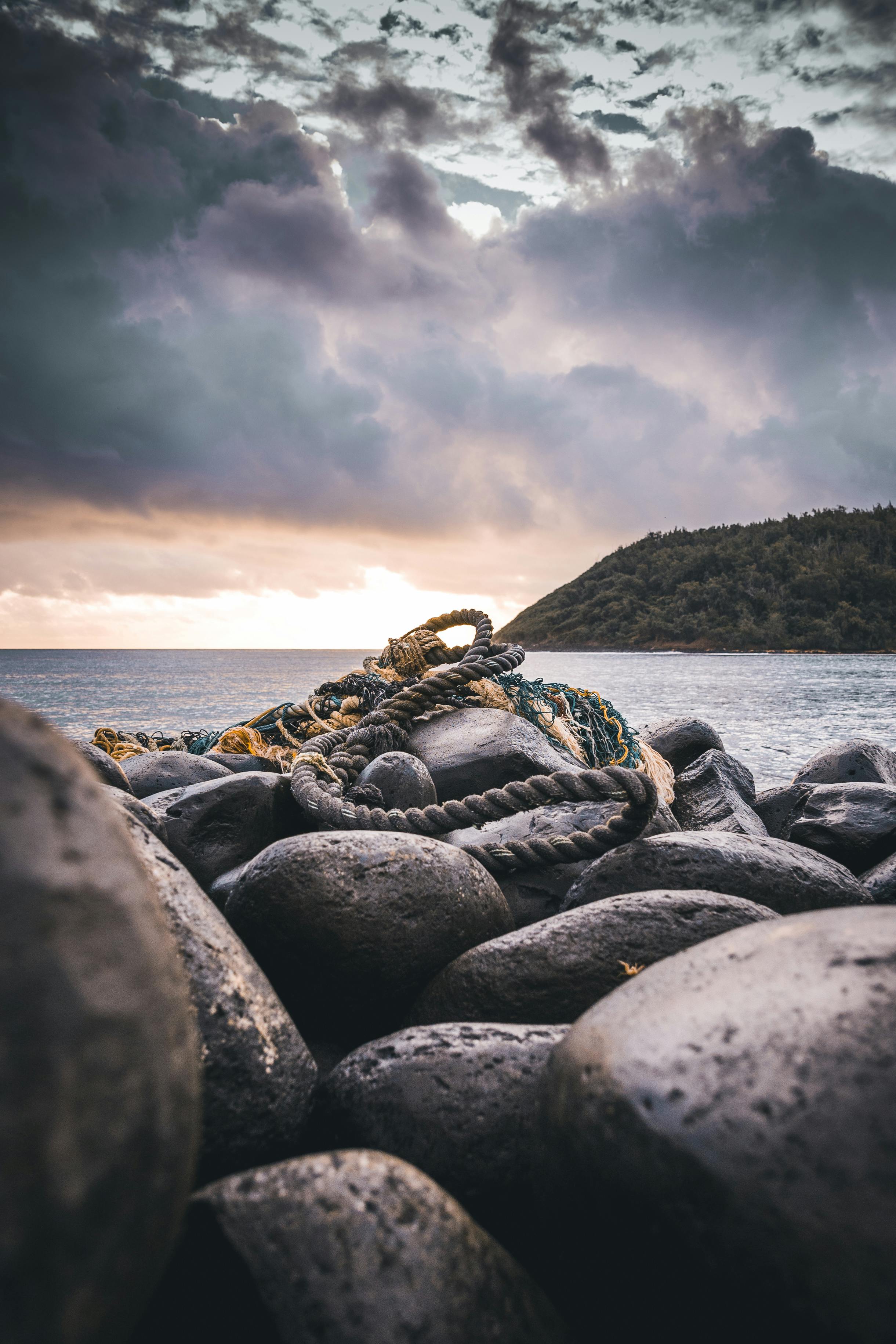 Rope On Rocks Near Ocean · Free Stock Photo