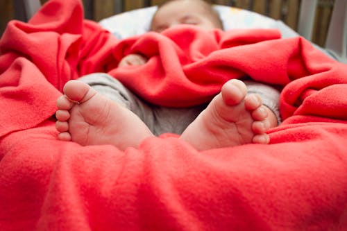 Free Baby Sleeping On Bed Stock Photo