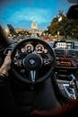 Person Holding Bmw Steering Wheel