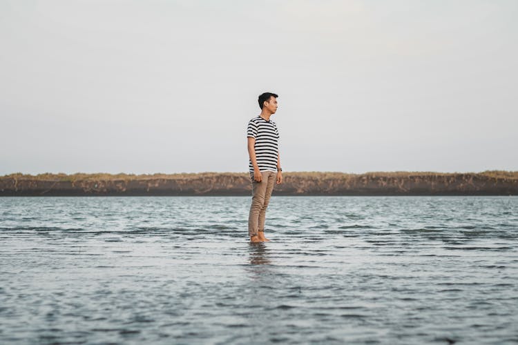 Photo Of Man Wearing Striped Shirt