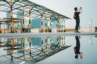 Photo of Man Standing Near Puddle