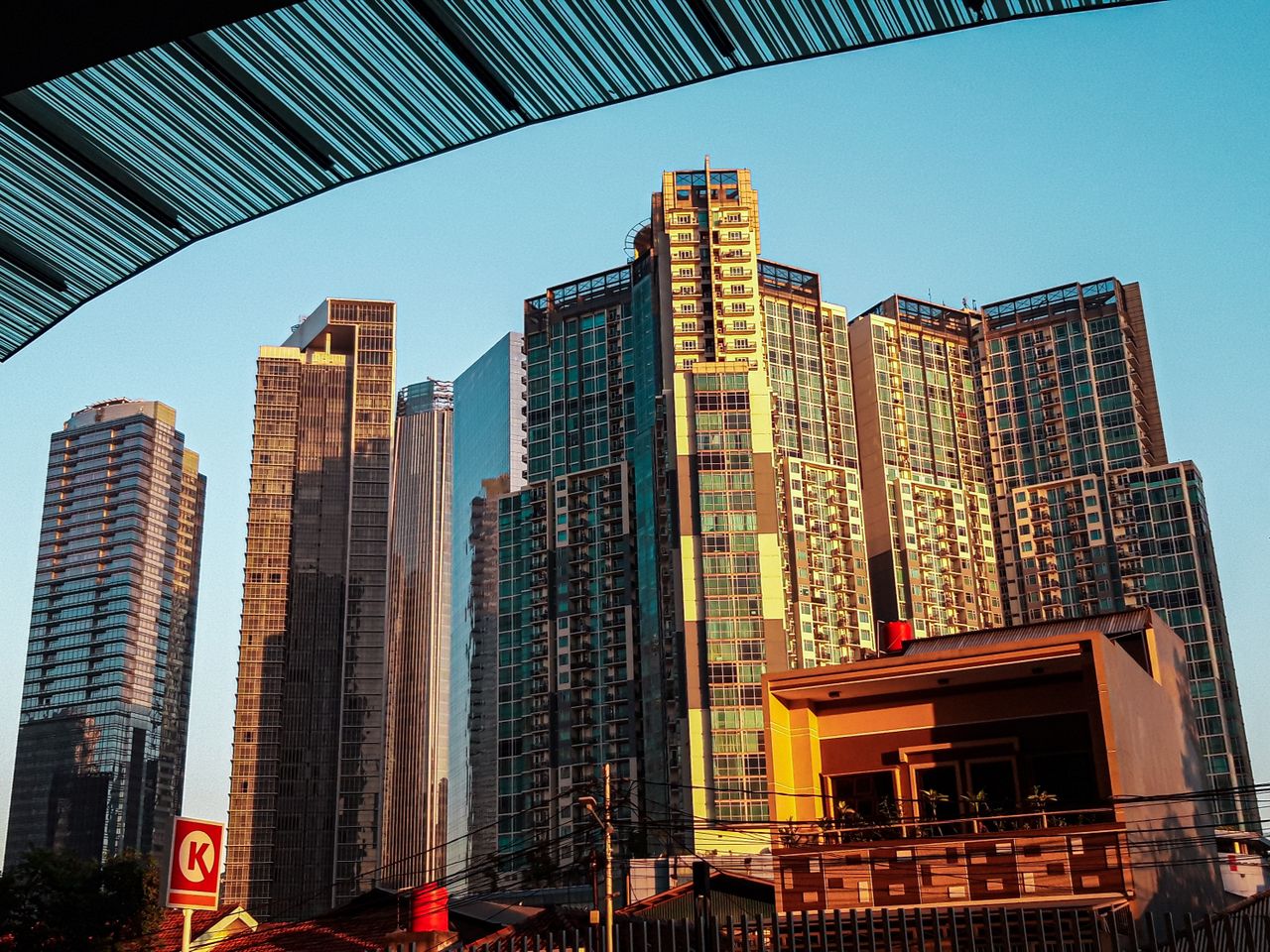 Stunning skyline of modern skyscrapers in Jakarta, Indonesia at sunset.