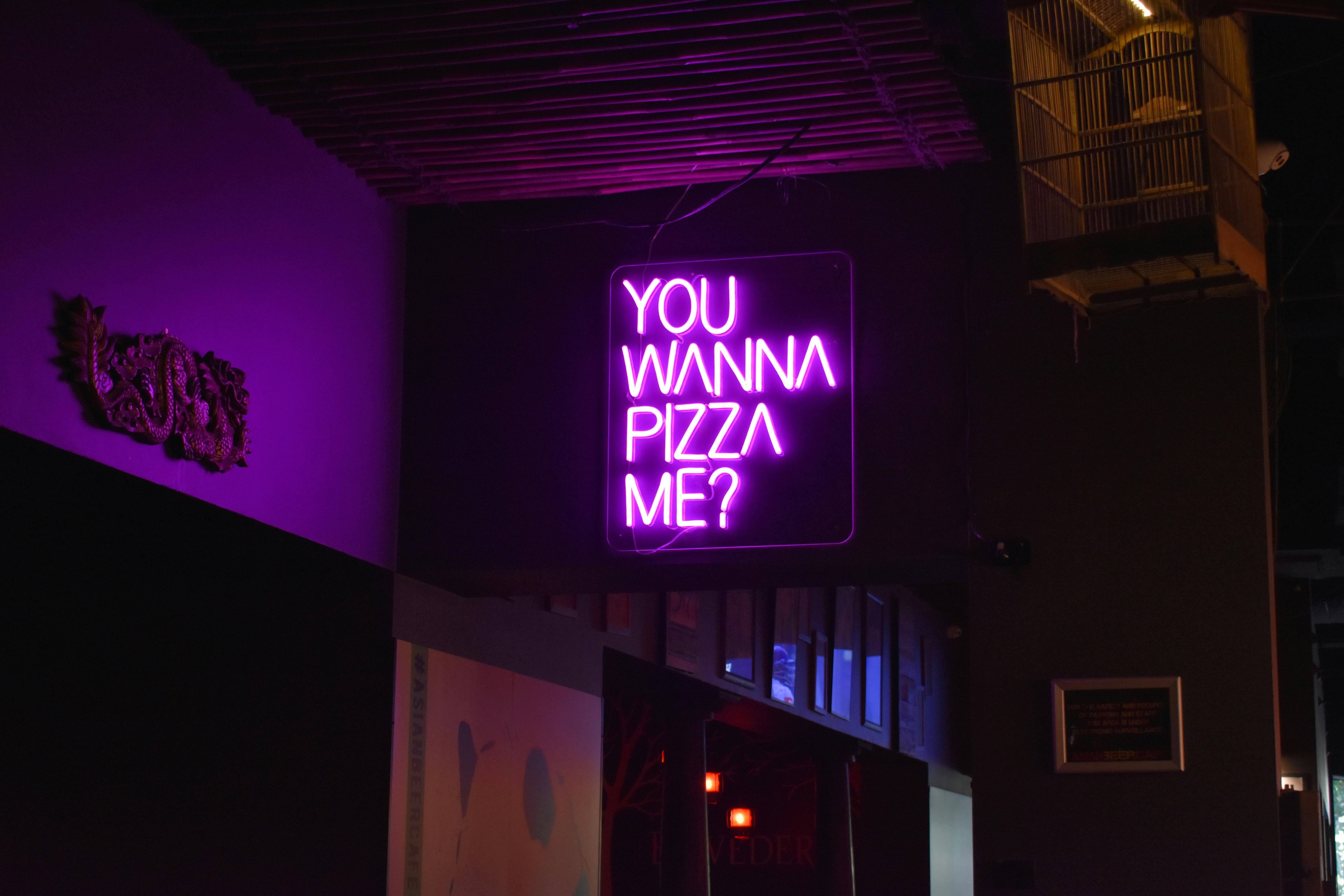 Photo of a Purple Neon Signage