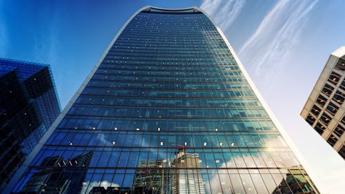 Free Low Angle Photo of Glass Building Stock Photo