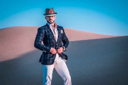 Photo of a Man Standing in Desert
