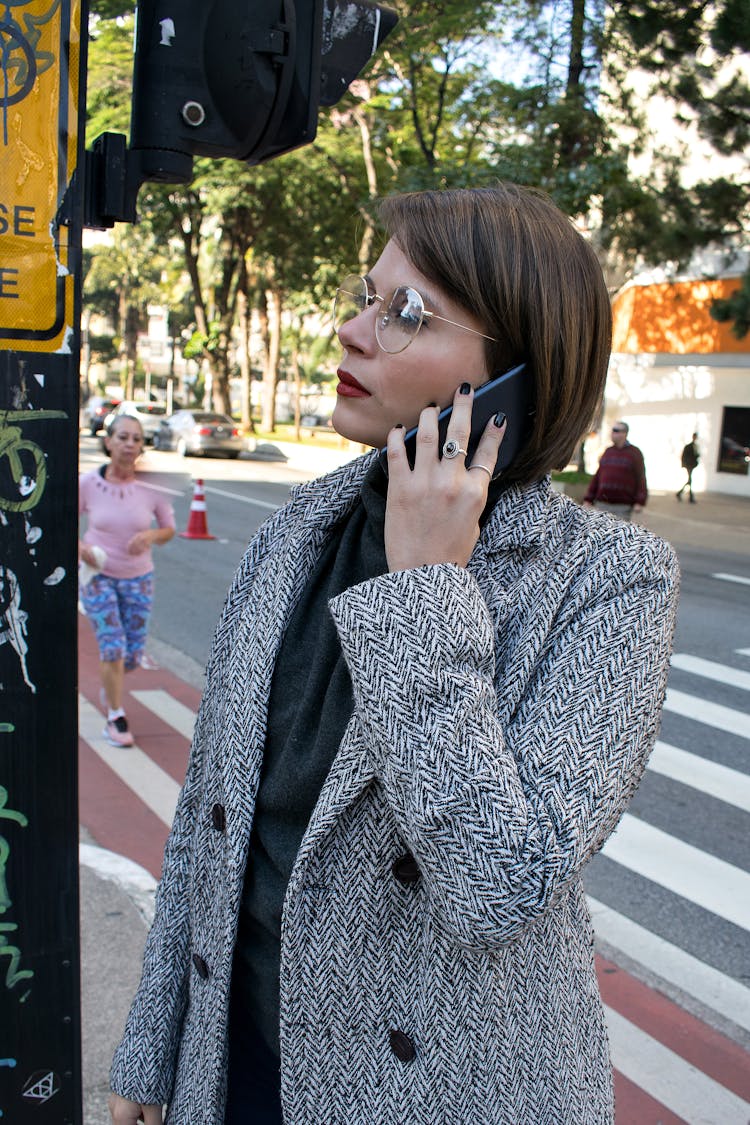 Photo Of A Woman Calling Someone With Her Mobile Phone