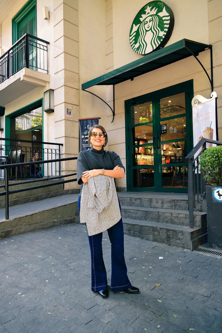 Photo Of A Woman Standing Outside Starbucks 