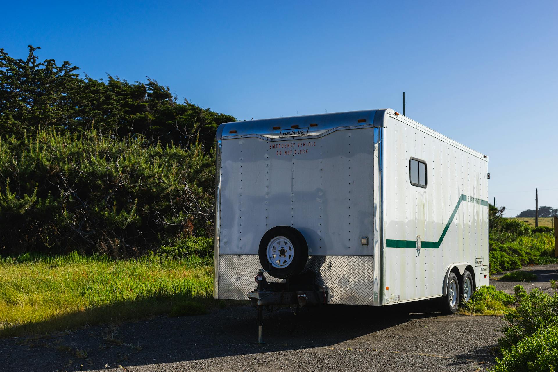 RV Trailer on Road in Countryside