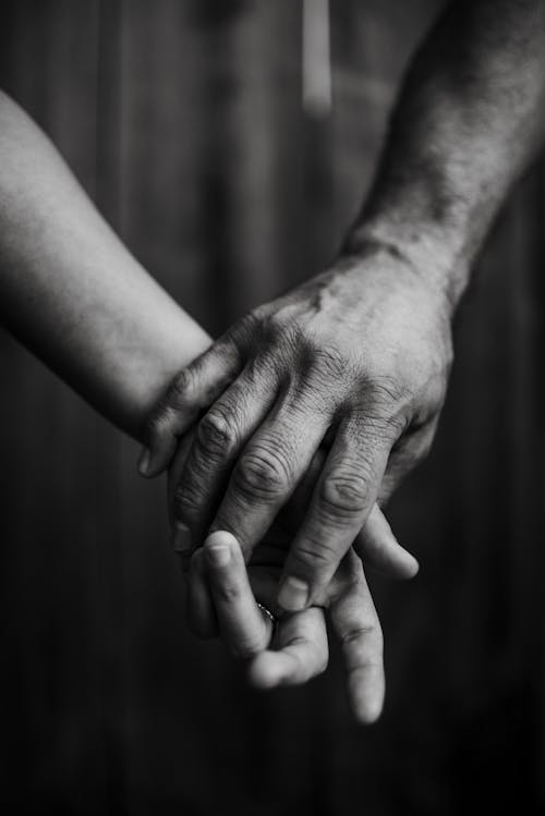 Couple Holding Hands in Black and White 