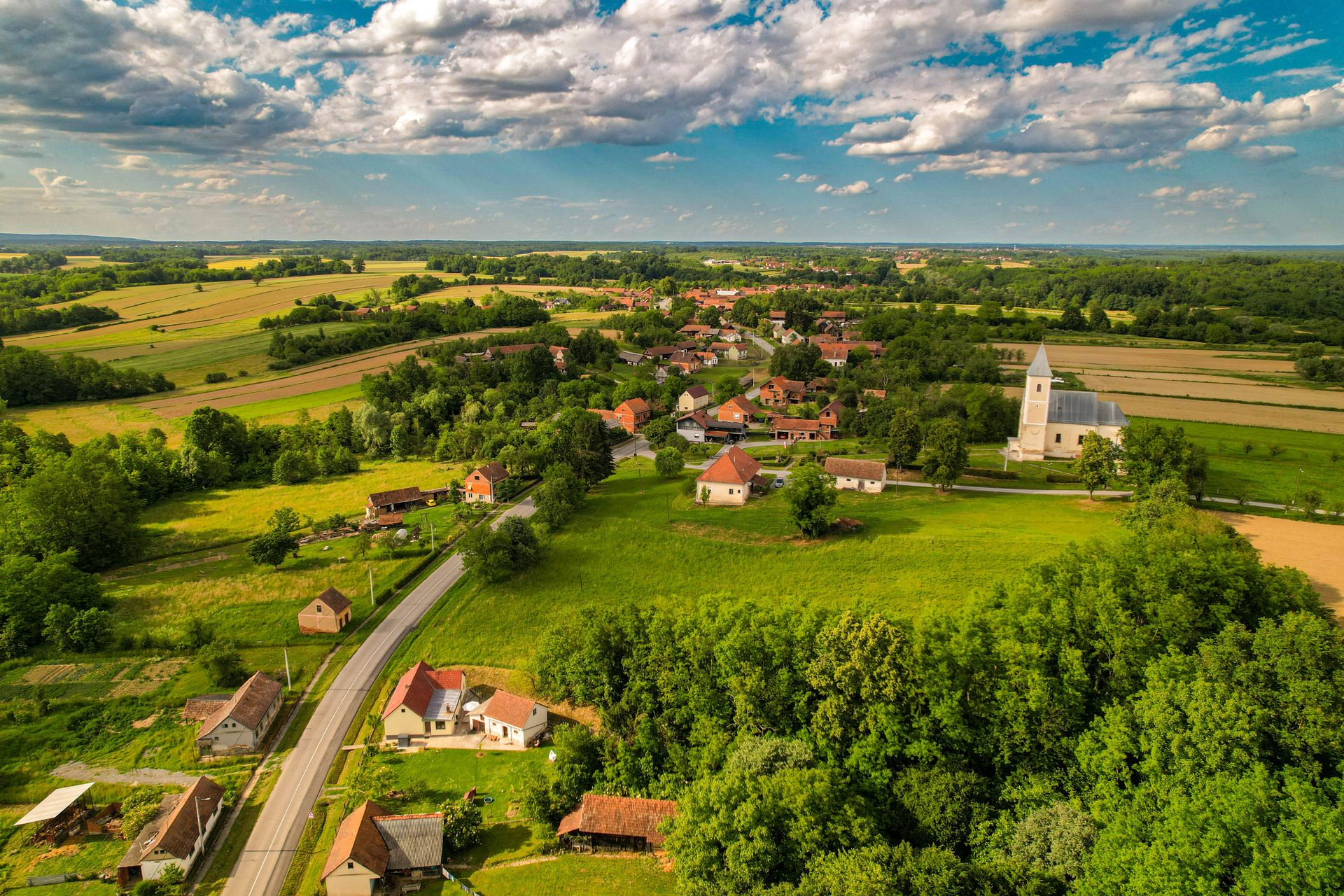 Scenic aerial landscape of Kaniška Iva village surrounded by lush greenery in Croatia.
