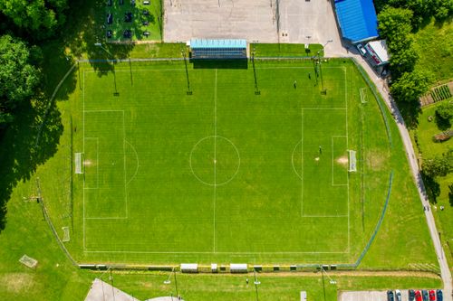 Free Drone shot of an empty soccer field in Garešnica, Croatia during the day. Stock Photo