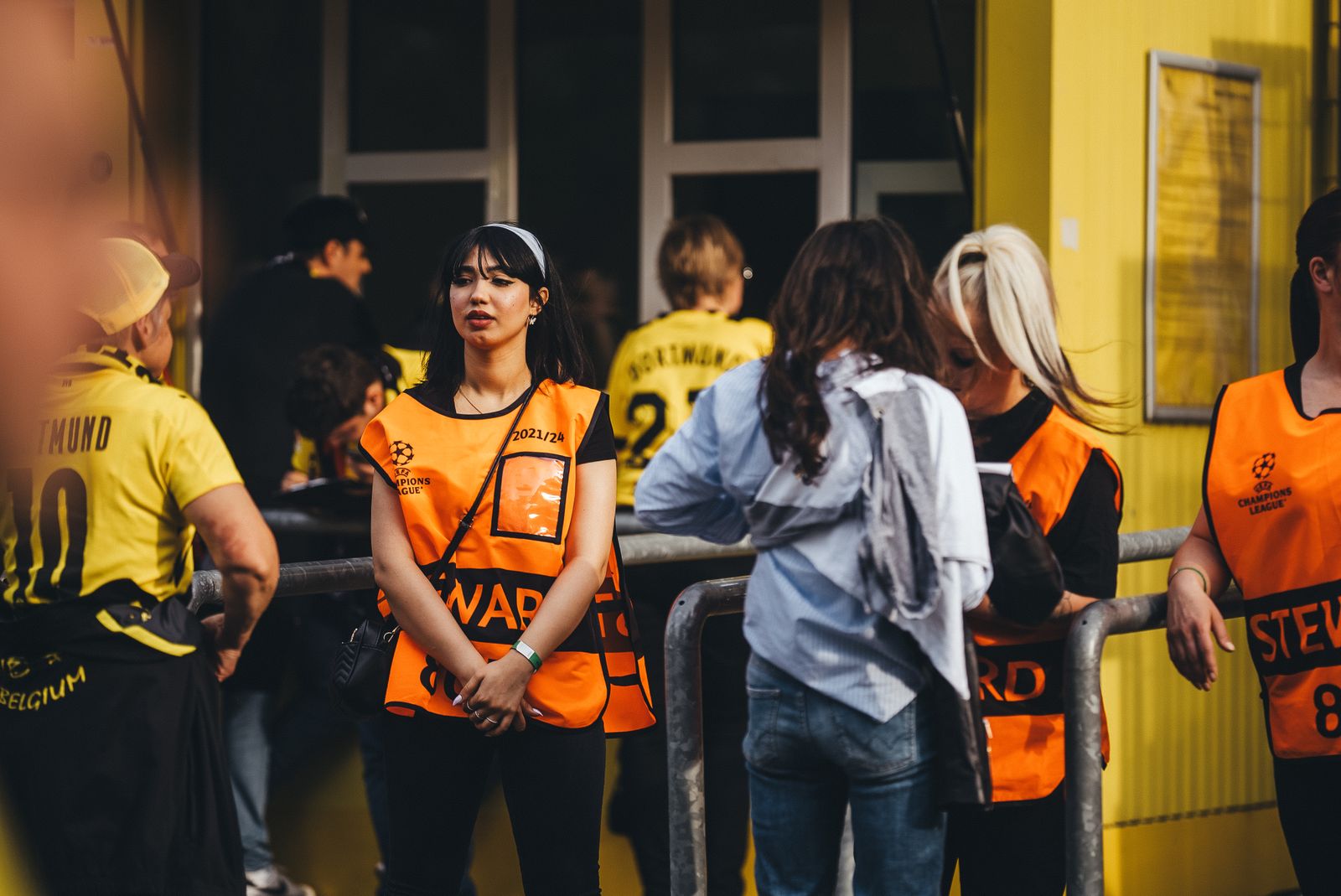 Event stewards assisting guests at a venue entrance
