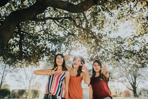 Free Women Standing Under Tree Stock Photo