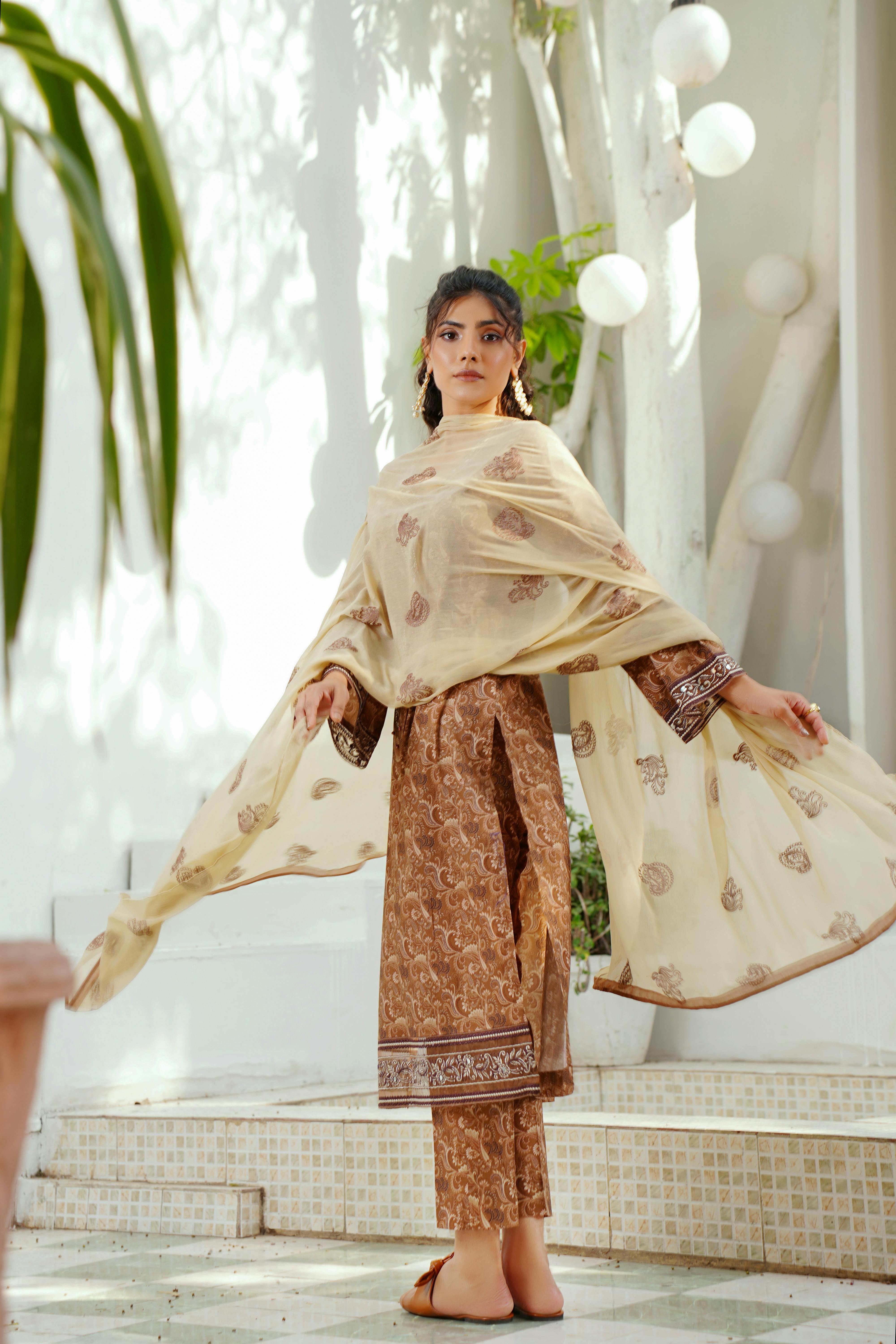 a young fashionable woman wearing a traditional dress