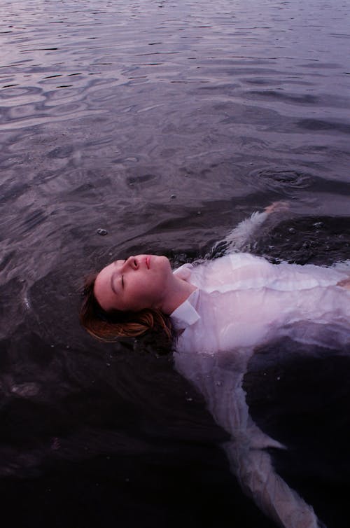 Free Woman On Body Of Water Stock Photo