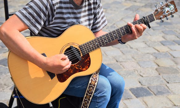A musician strumming an acoustic guitar on a cobblestone street, enjoying outdoor leisure.