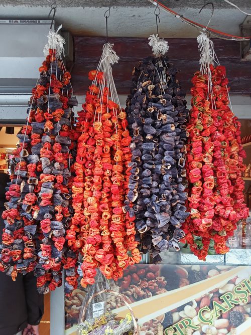 Free Colorful dried peppers hanging in a Yalova market, showcasing local Turkish produce. Stock Photo