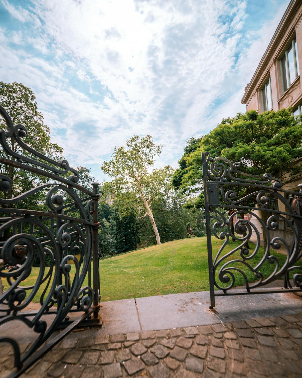 Metal Opened Gate Near a Building · Free Stock Photo Metal Opened Gate Near a Building · Free Stock Photo