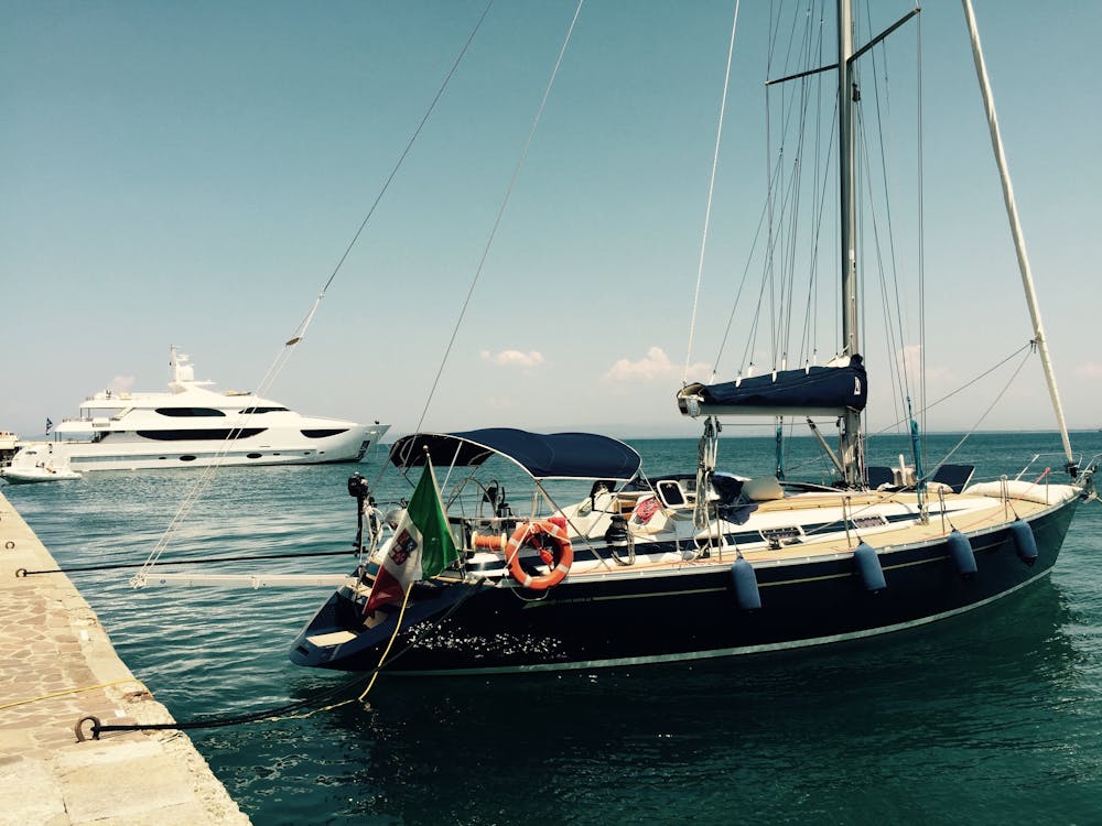 Free White and Black Boat on Water Stock Photo