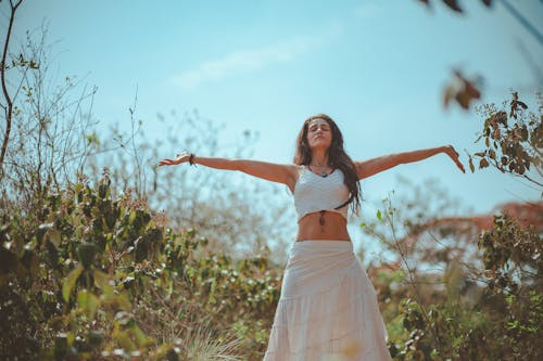 Free Woman Spreading Both Her Arms Stock Photo