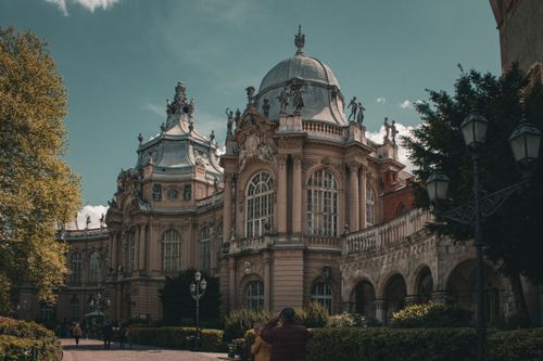 Free Stunning view of the historic dome and statues of a museum building in Budapest, Hungary. Stock Photo