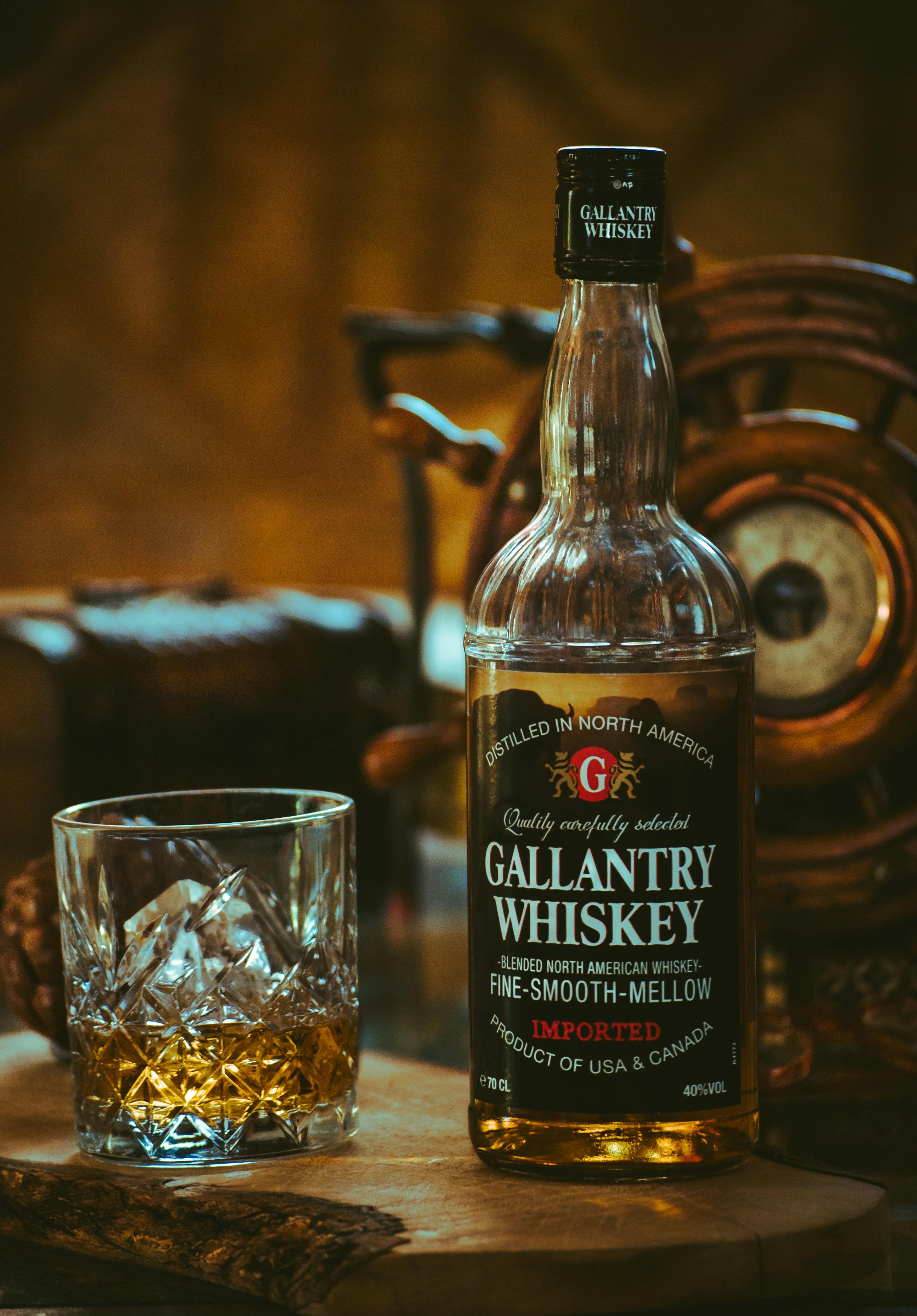 Gallantry Whiskey Bottle Beside Glass Free Stock Photo