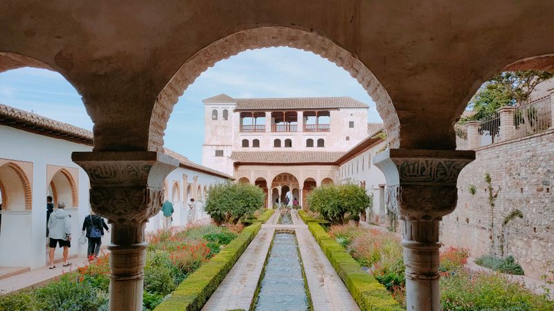 Patio de la Acequia courtyard with long pool and hedges at the Generalife, Granada