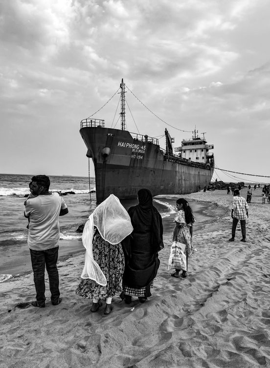 Man Roop In Ship People and Cargo Ship Moored on Seashore · Free Stock Photo
