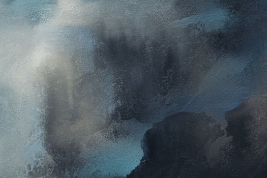Abstract artwork featuring textured gray and blue hues with a cloud-like appearance.