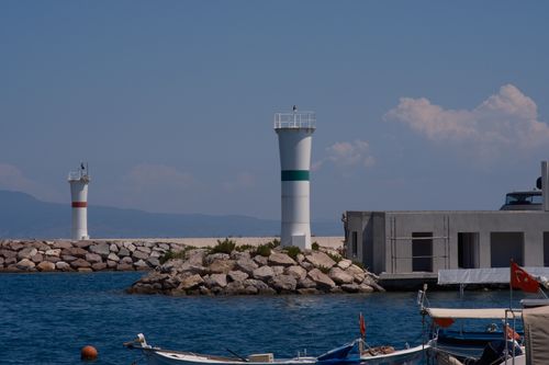 Free Panoramic view of lighthouses by the sea at Foça harbor in İzmir, Türkiye. Stock Photo