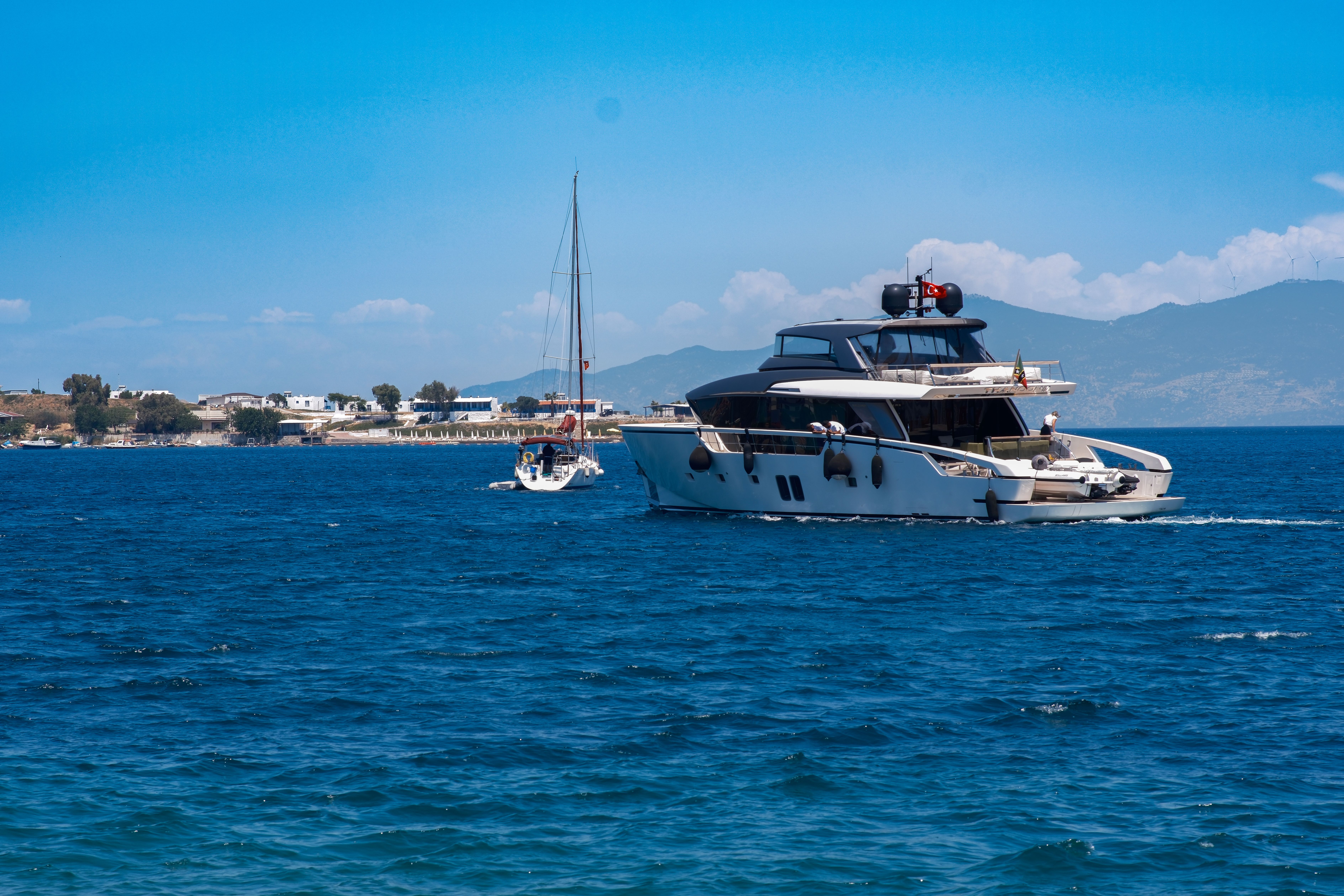 Spectacular Suluada Island Boat Tour from Kemer Review: Your Complete Guide to Turkey's Hidden Maldives Review 2026 - A luxury yacht cruising in the clear waters of Foça, İzmir under a sunny sky.