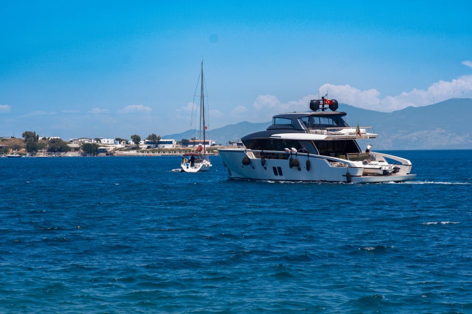 Spectacular Suluada Island Boat Tour from Kemer Review: Your Complete Guide to Turkey's Hidden Maldives Review 2026 - A luxury yacht cruising in the clear waters of Foça, İzmir under a sunny sky.