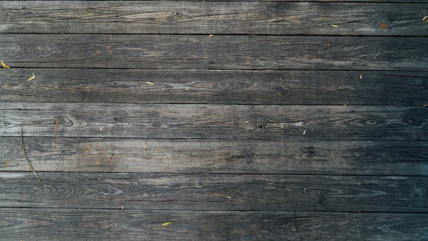 Close-up of rustic wooden planks with natural wood grain texture, perfect for backgrounds or design projects.