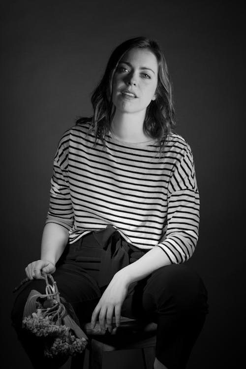 Photo of Woman Wearing Striped Shirt