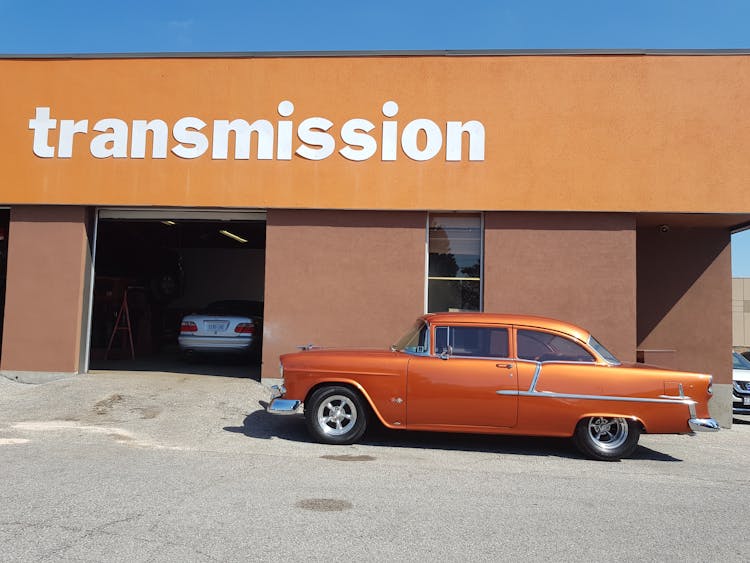 Photo Of Classic Car Parked In Front Of Building