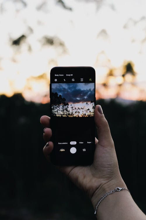 Photo of Person Holding Smartphone