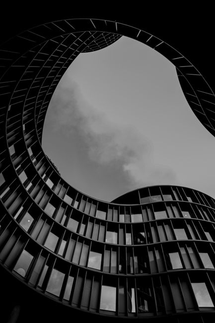 Stunning black and white photo of the curved facade of Axel Towers in Copenhagen.
