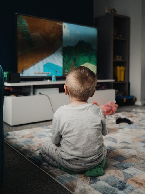 a child sat down playing video games
