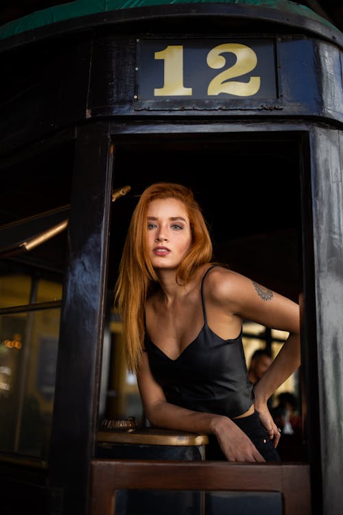 Photo of Woman Leaning on Table