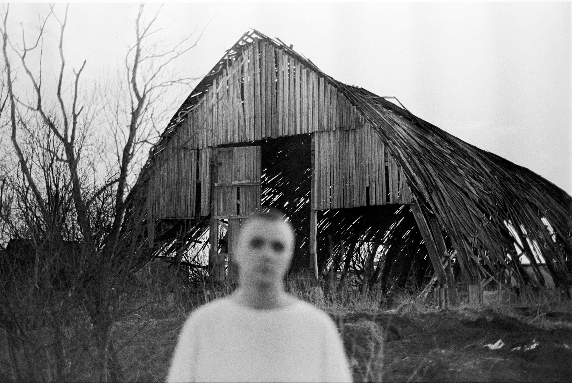 Man against Broken Barn