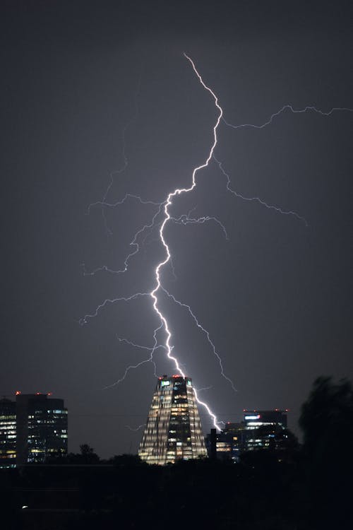 Lightning strikes over a city skyline