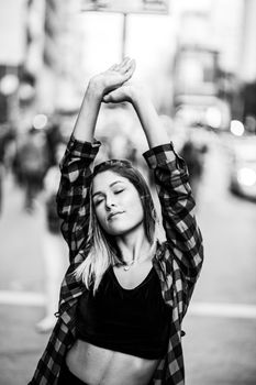 Casual black and white portrait of a woman posing in São Paulo.