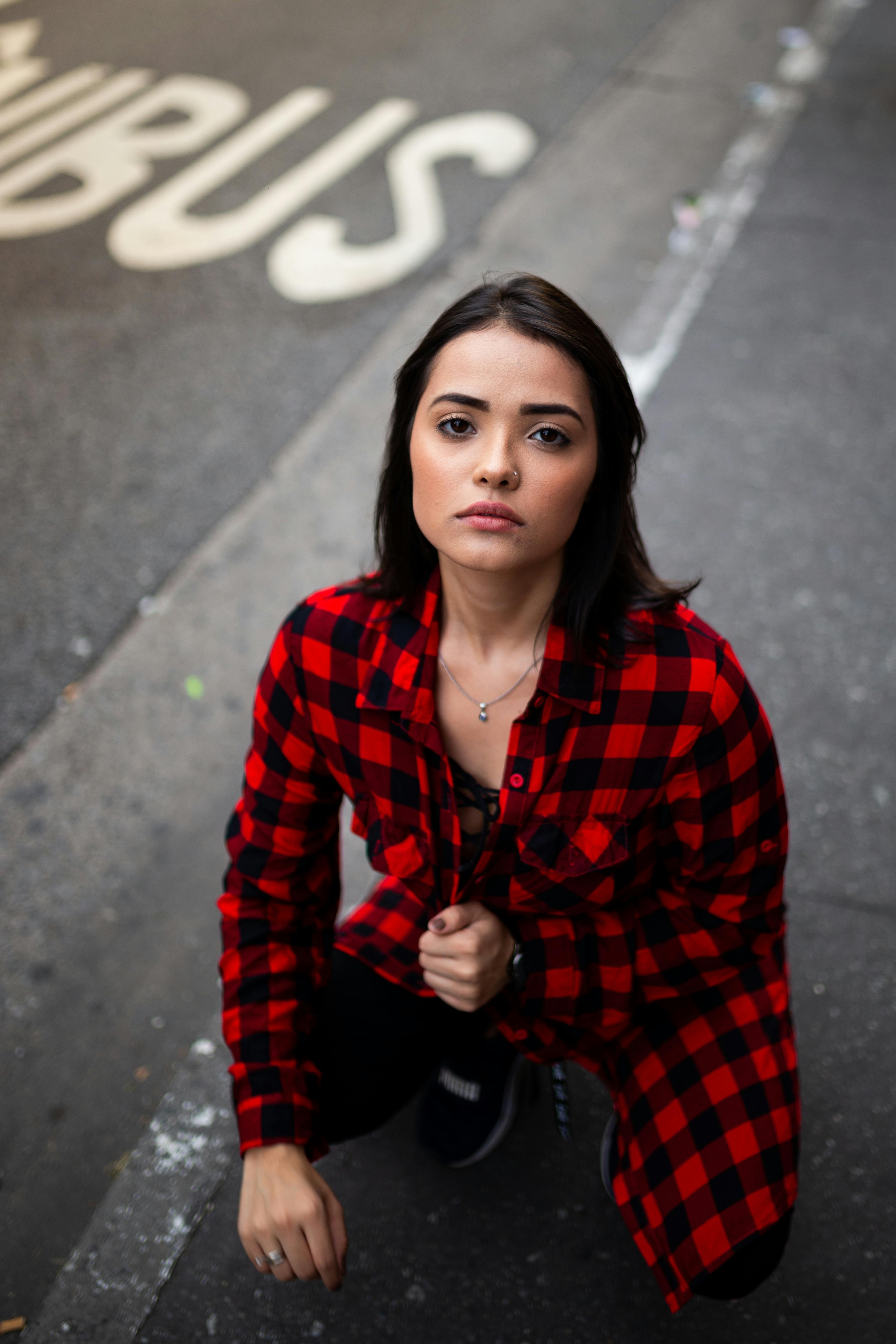 Portrait Young Beautiful Redhead Woman Flannel Shirt Holding Stack