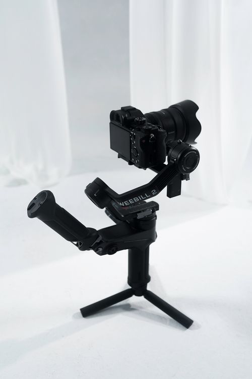 Free Professional camera setup on a Weebill stabilizing gimbal in a studio setting. Stock Photo