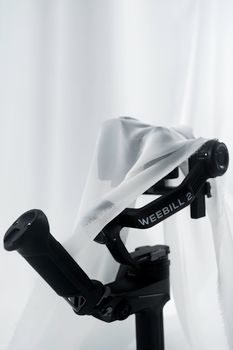 Close-up of Weebill 2 gimbal wrapped in fabric for an artistic studio presentation.