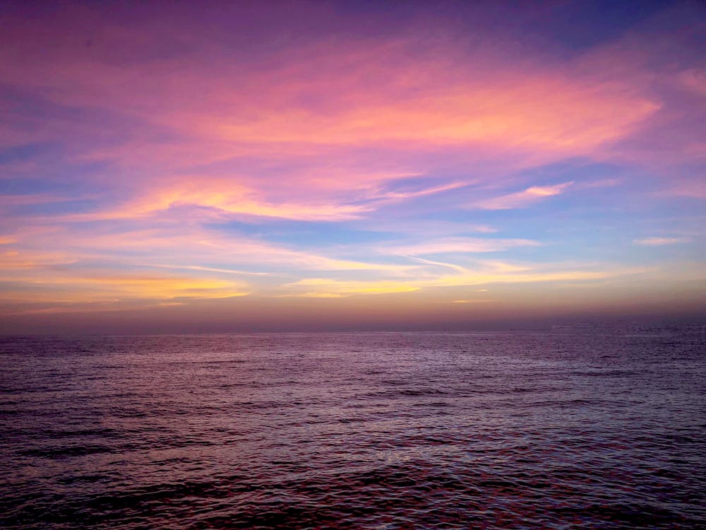 Free Scenic Photo of Sea Under Purple Sky Stock Photo
