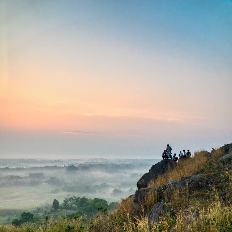 Photo Of Group Of People On Top Of Mountain