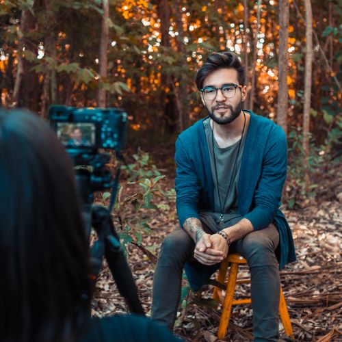 Creator being filmed outdoors by Ro Acunha on Pexels