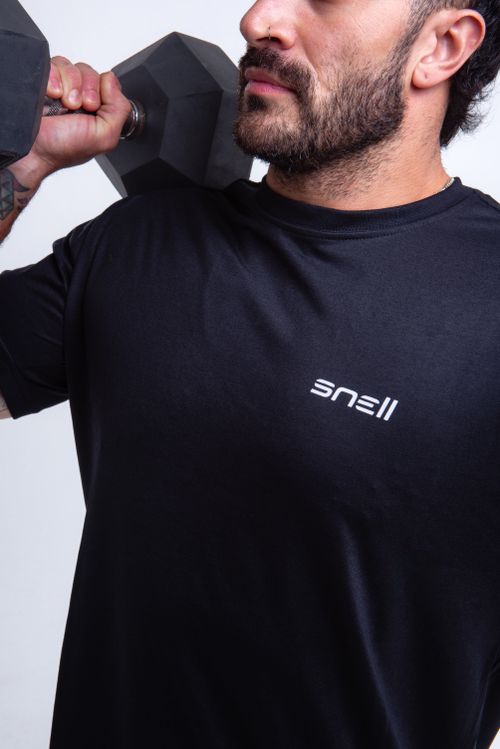 Free Close-up of a man in sportswear holding a dumbbell, showcasing fitness and strength. Stock Photo